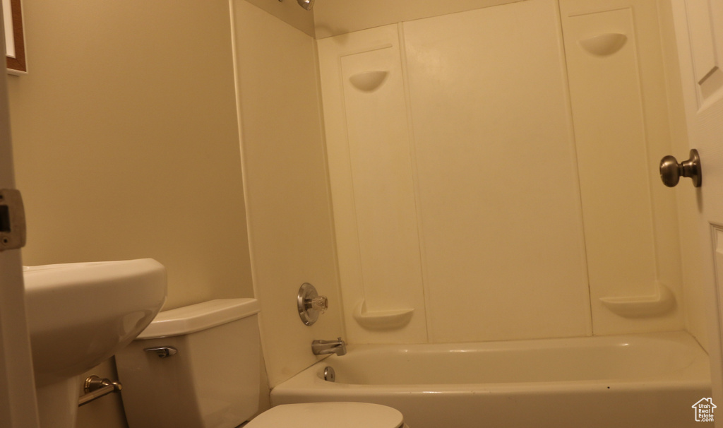 Bathroom with shower / bathtub combination and toilet