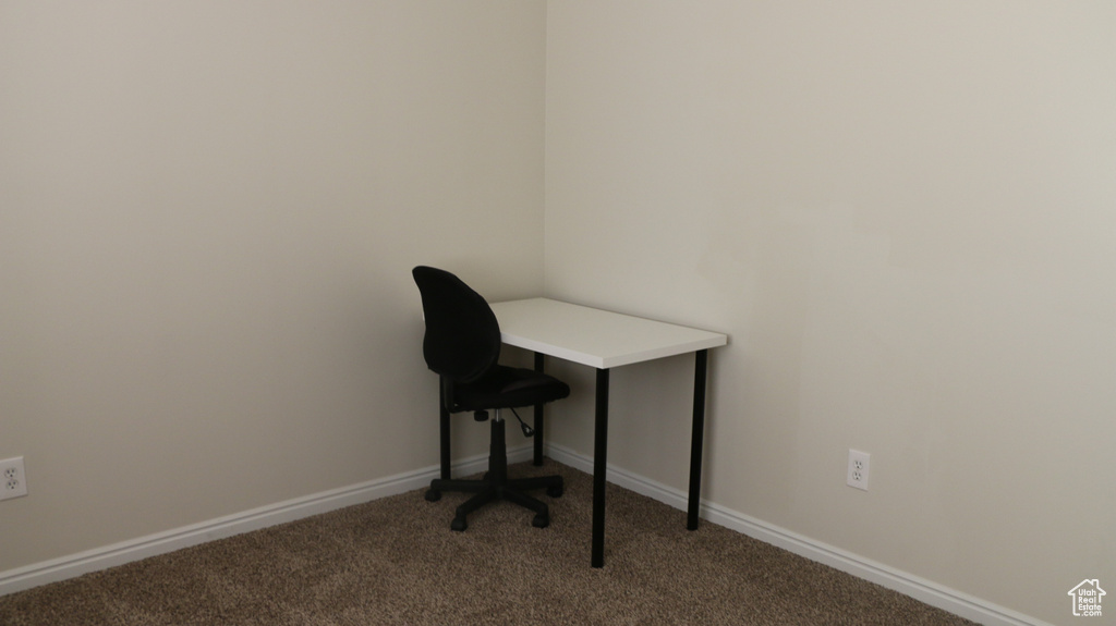 Unfurnished office with light colored carpet and baseboards