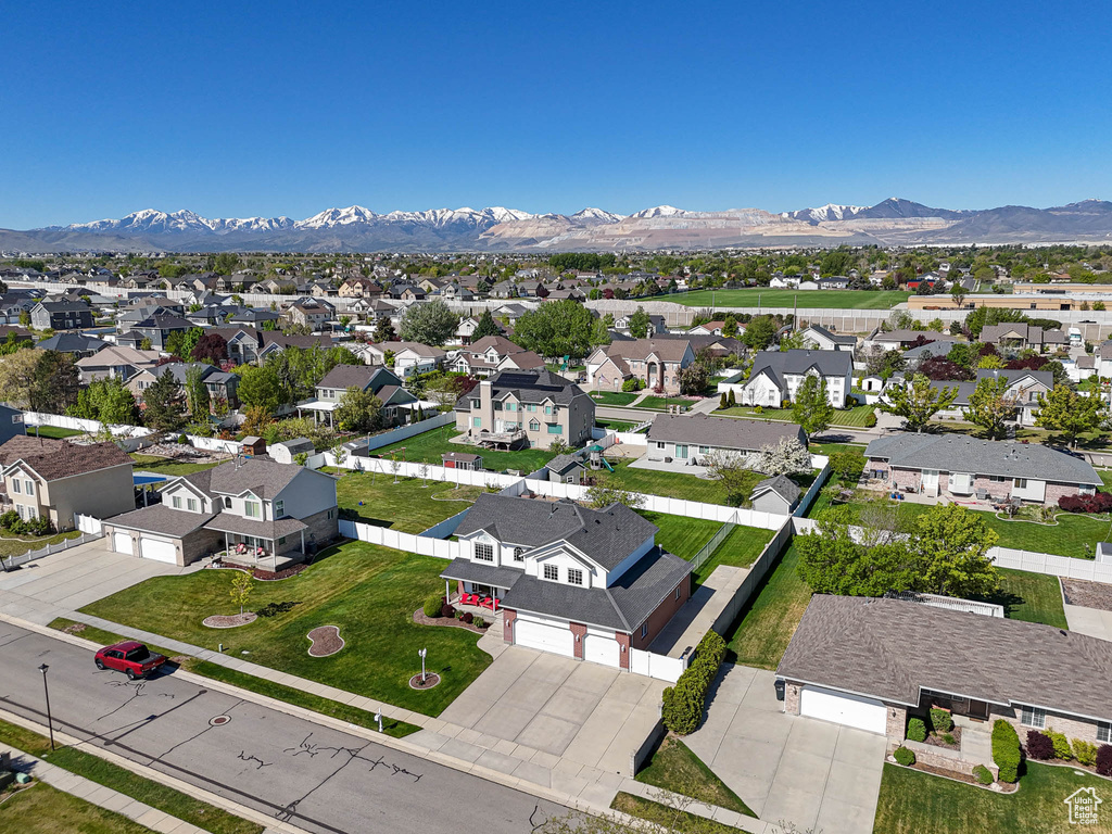 Birds eye view of property with a residential view and a mountain view