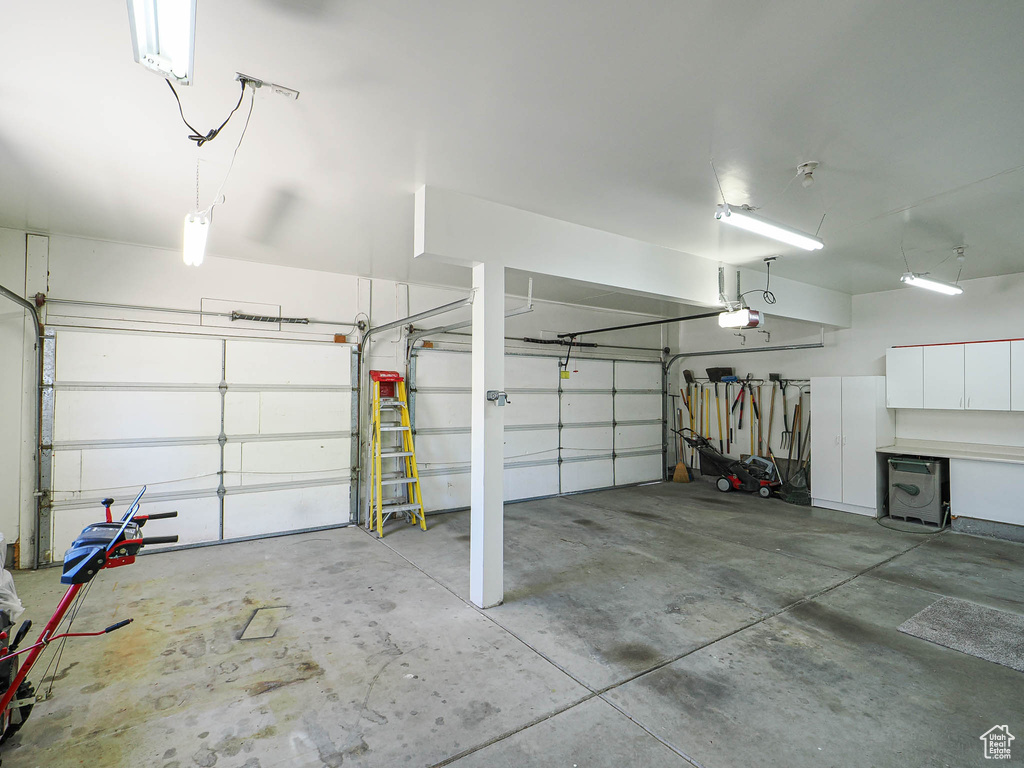 Garage featuring a garage door opener