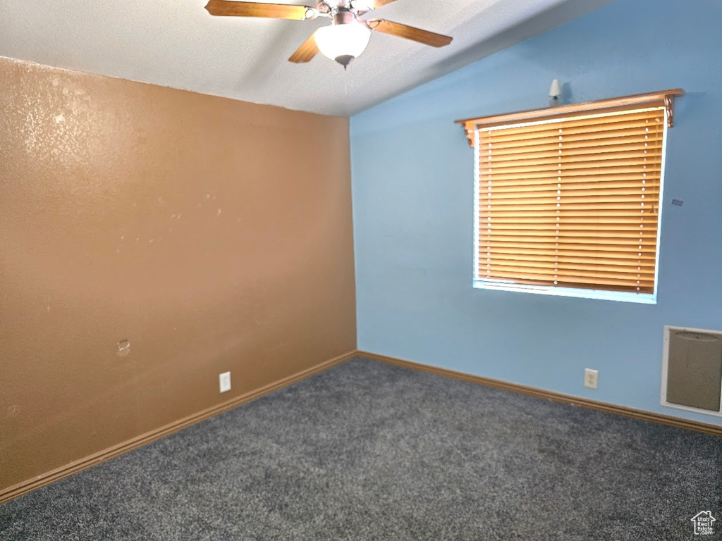 Carpeted spare room with baseboards, ceiling fan, and visible vents