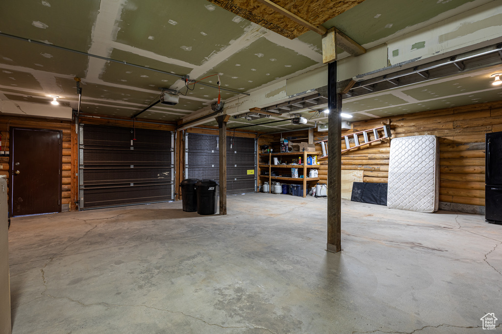 Garage featuring a garage door opener