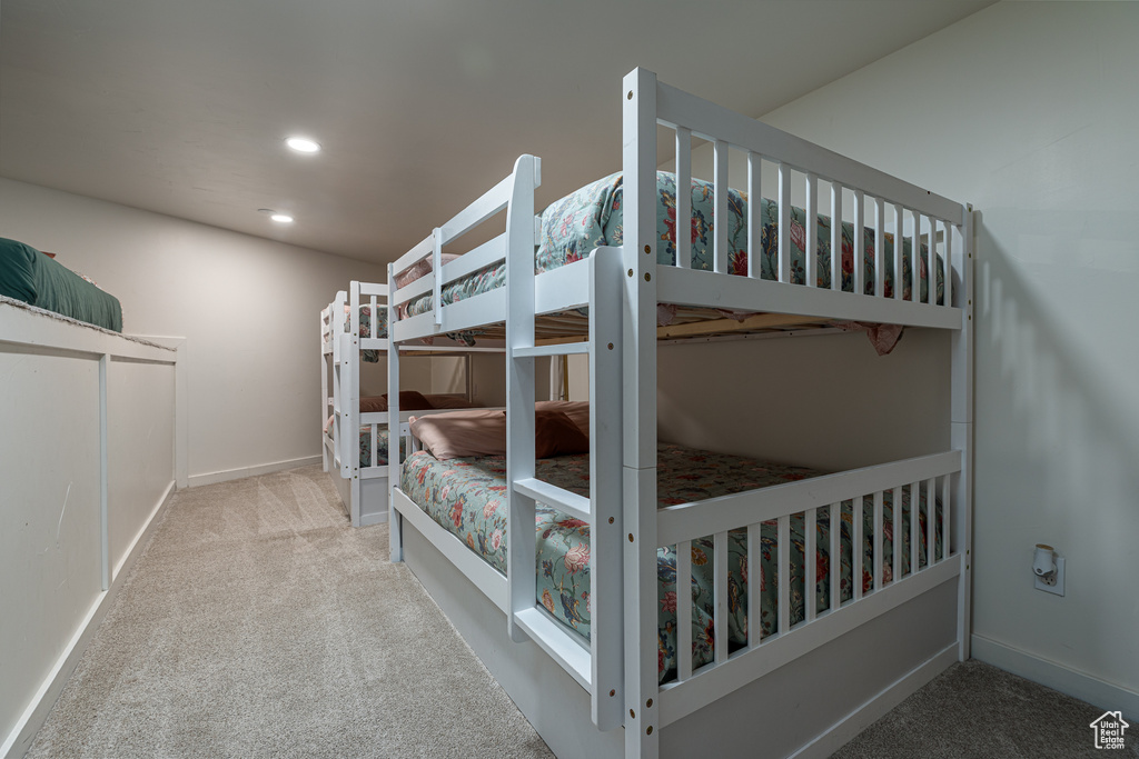 Carpeted bedroom featuring recessed lighting and baseboards