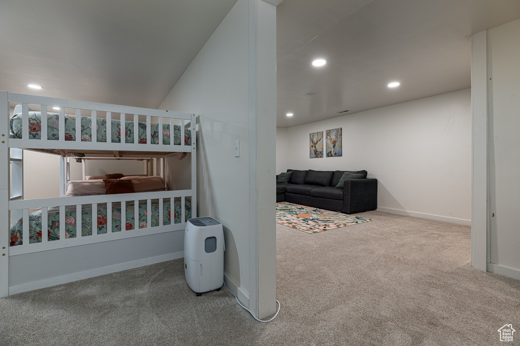 Carpeted bedroom with recessed lighting and baseboards