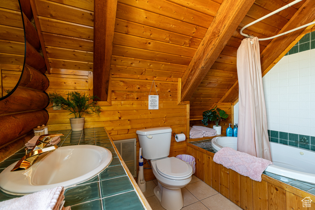 Bathroom featuring visible vents, toilet, tiled shower / bath, tile patterned floors, and a sink