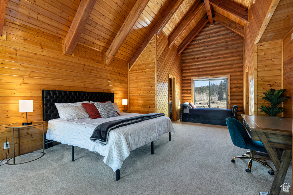 Bedroom with wooden ceiling, beam ceiling, and carpet