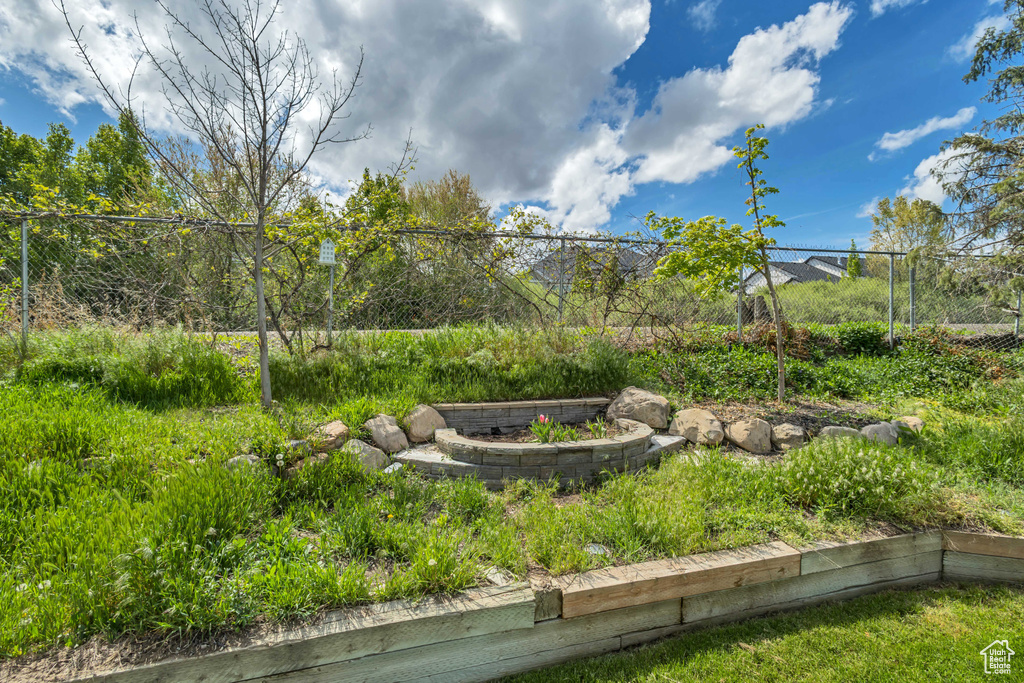 View of yard featuring fence