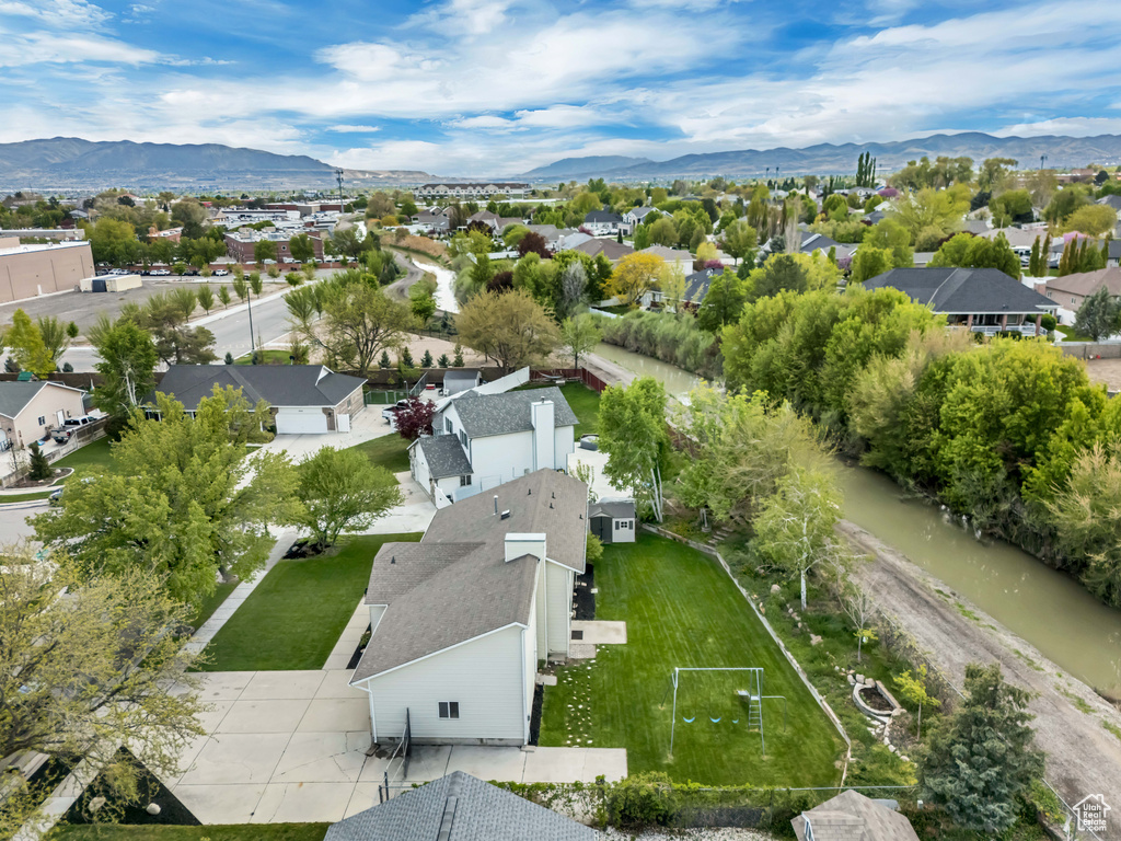 Birds eye view of property featuring a mountain view and a residential view