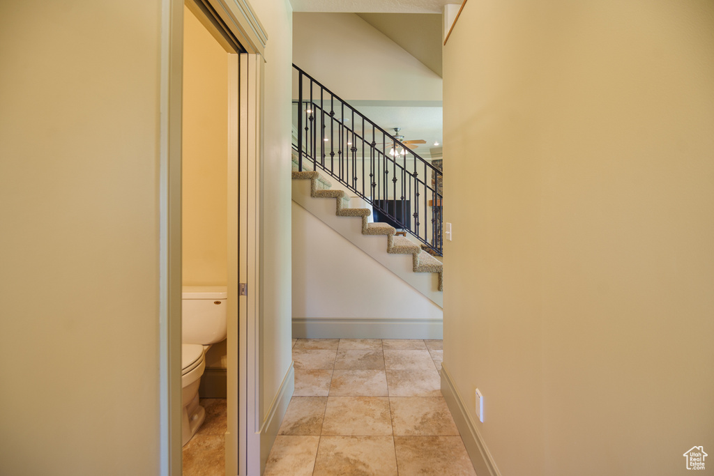 Stairway featuring baseboards