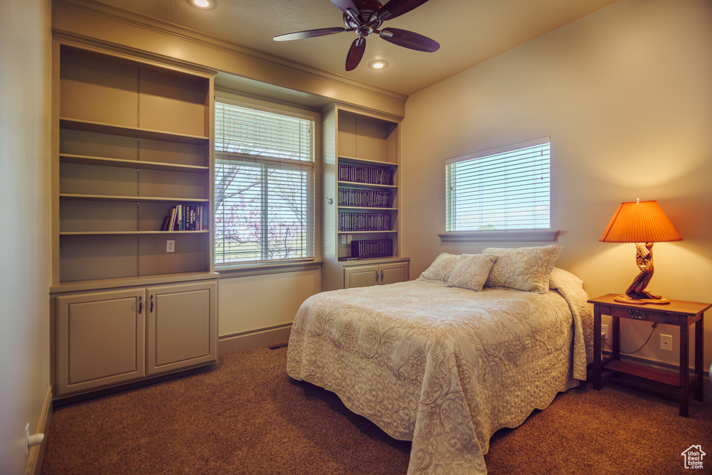 Carpeted bedroom with baseboards, ornamental molding, ceiling fan, and recessed lighting