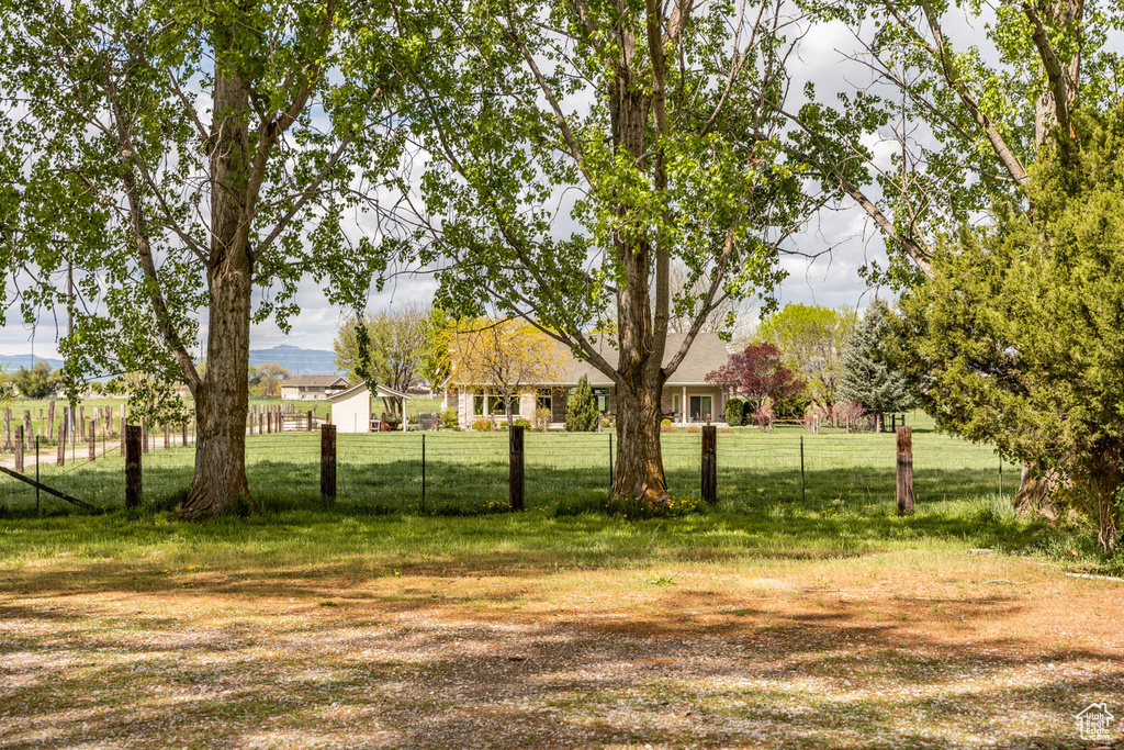 View of yard featuring fence