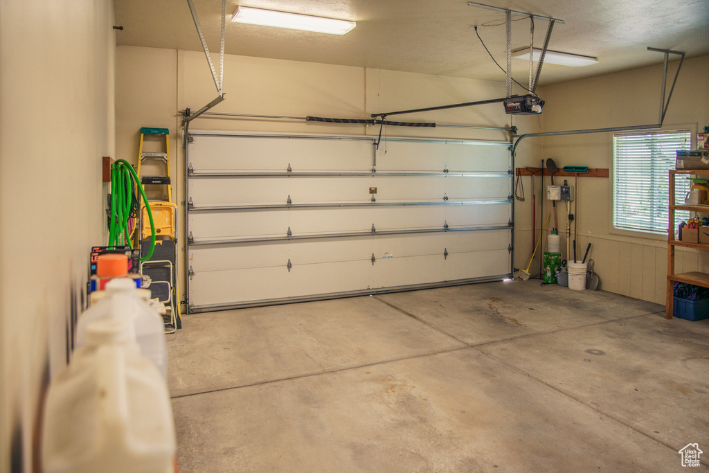 Garage featuring a garage door opener