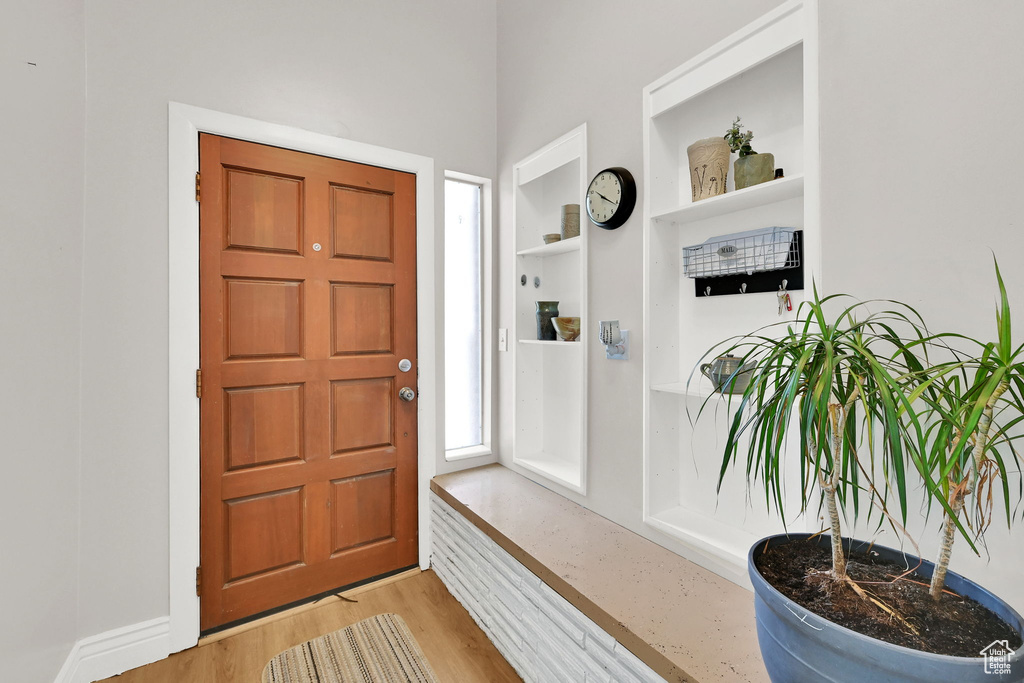Entrance foyer with light wood-style flooring