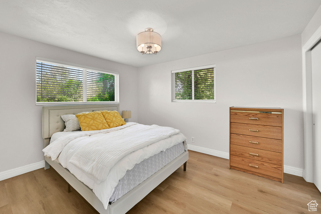 Bedroom featuring baseboards and light wood-style floors