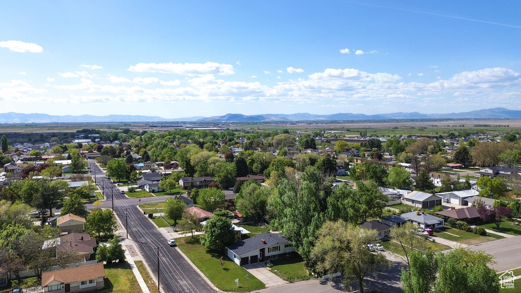 Birds eye view of property featuring a mountain view and a residential view