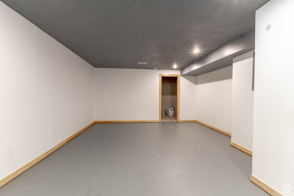 Finished below grade area featuring baseboards and recessed lighting