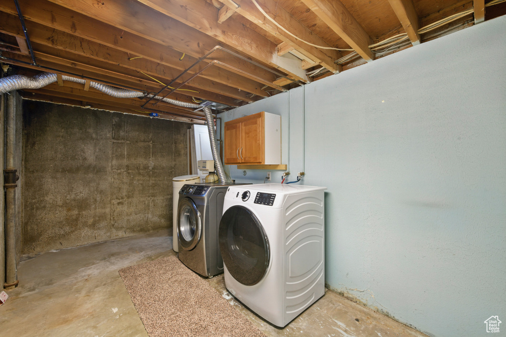 Laundry area with cabinet space and washer and dryer