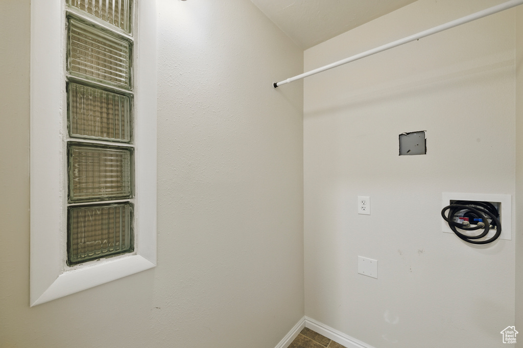 Clothes washing area with baseboards
