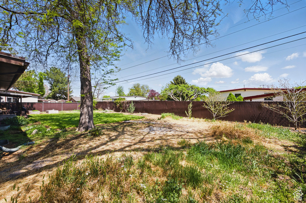 View of yard with a fenced backyard