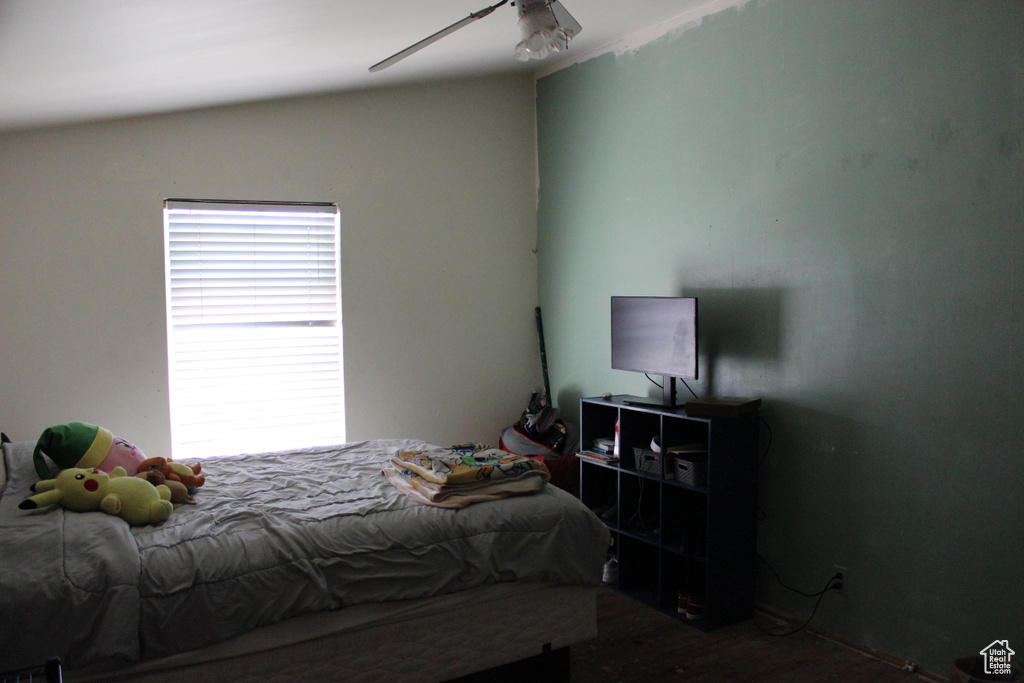 Bedroom with ceiling fan and wood finished floors