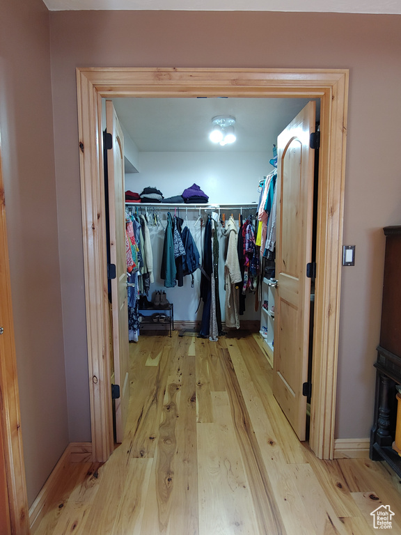 Hallway with wood finished floors