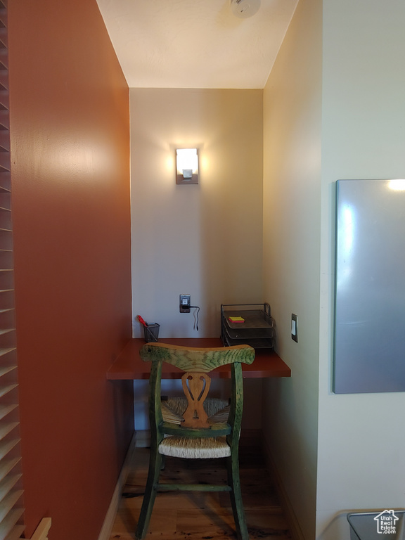 Interior space featuring baseboards and wood finished floors