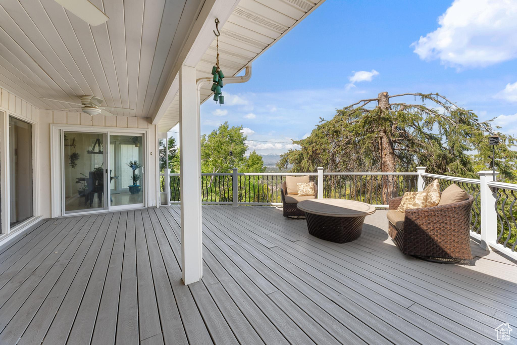 Wooden deck with a ceiling fan