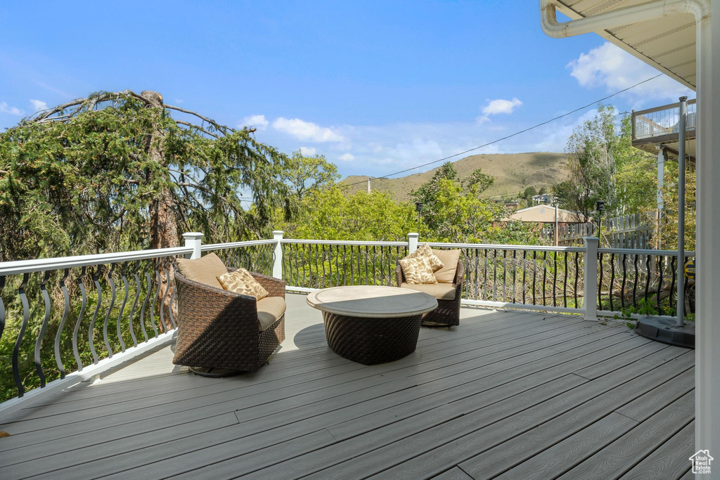 Wooden deck featuring a mountain view