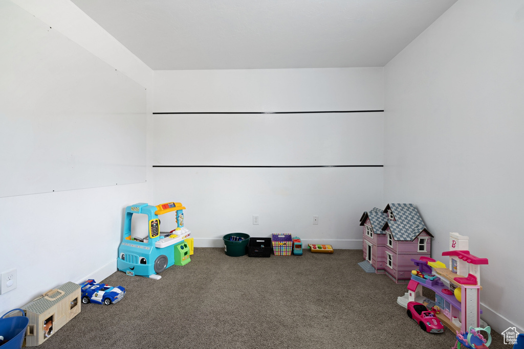 Playroom featuring baseboards and carpet flooring