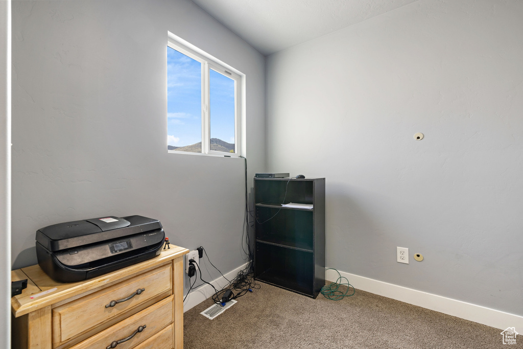 Misc room with baseboards and carpet floors