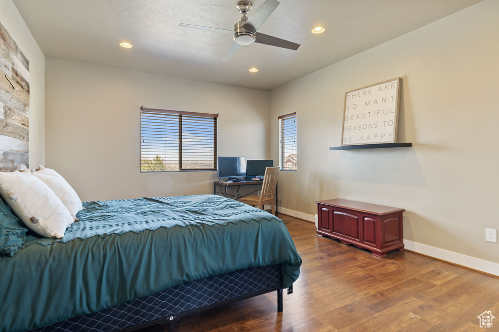 Bedroom with baseboards, recessed lighting, a ceiling fan, and wood finished floors