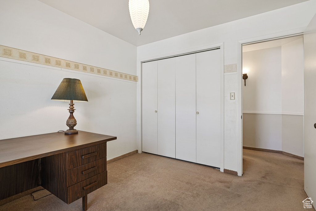 Office featuring baseboards and carpet