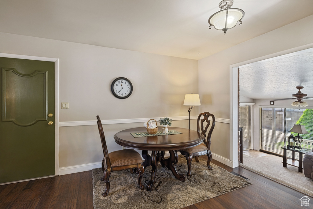 Dining room with baseboards and wood finished floors