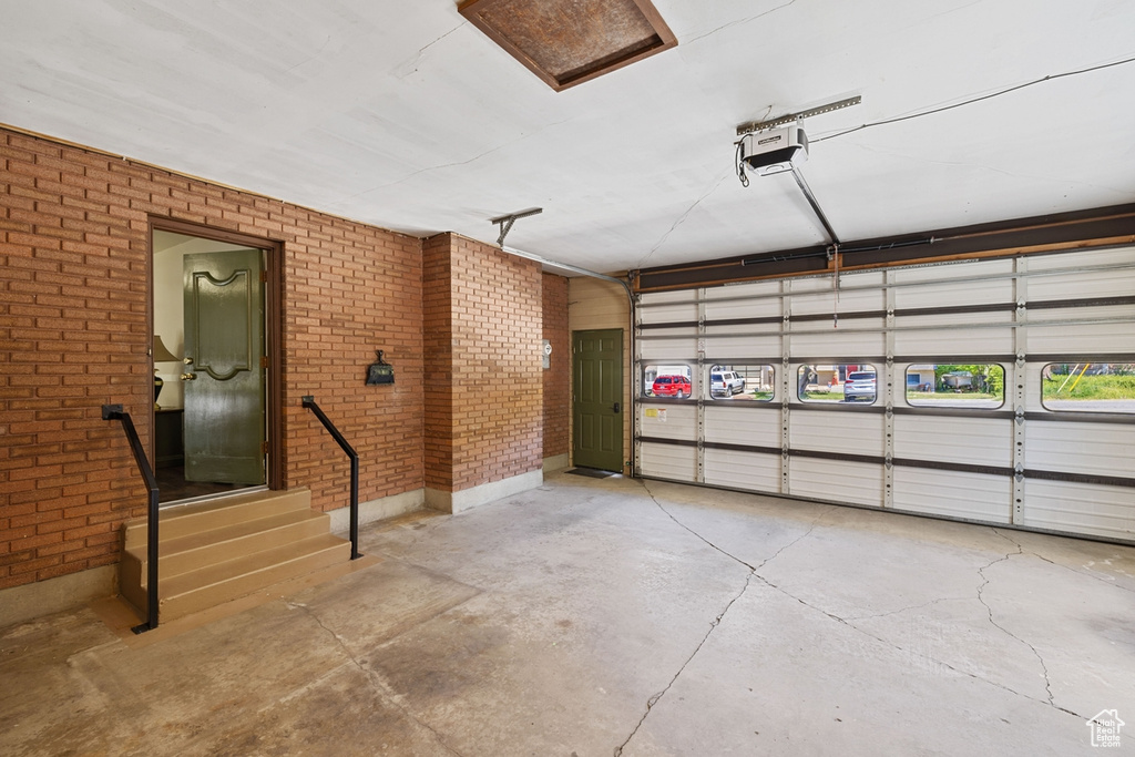 Garage featuring a garage door opener