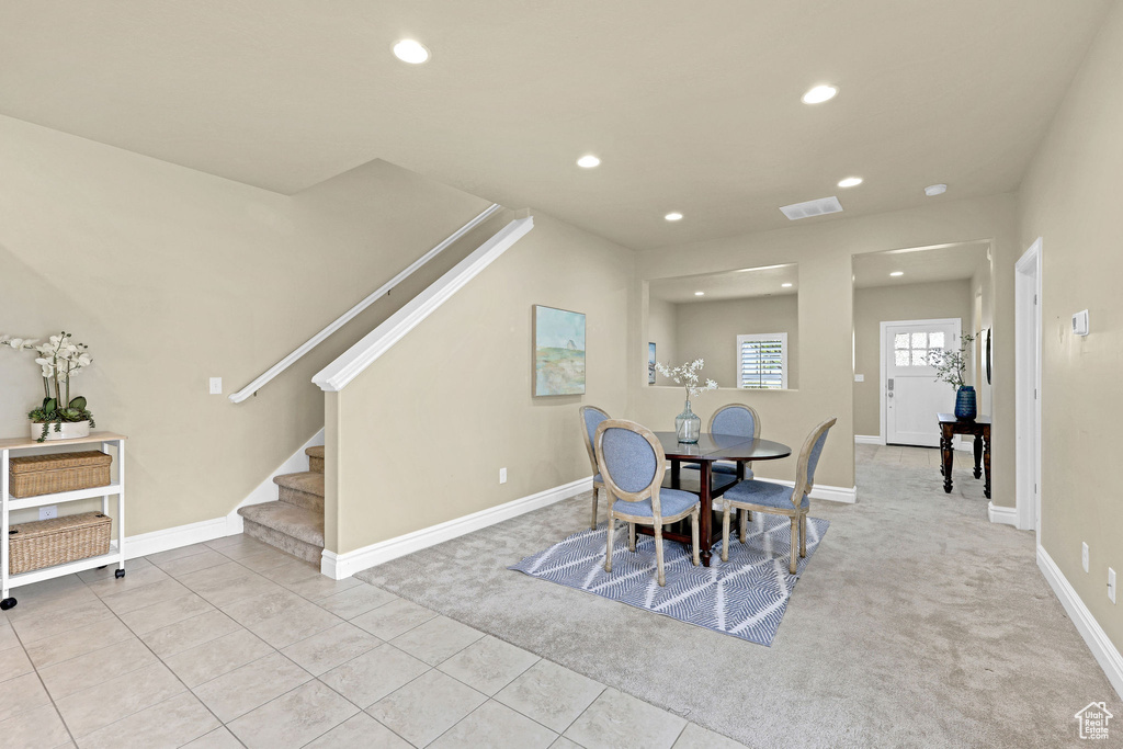 Dining space with visible vents, carpet flooring, stairs, and recessed lighting