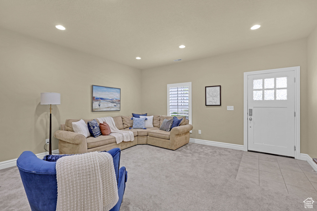Living room with recessed lighting, baseboards, and carpet floors