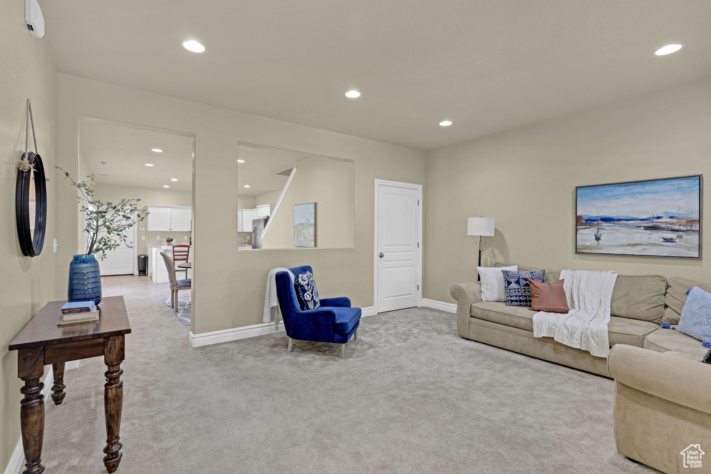 Living room with recessed lighting, carpet flooring, and baseboards