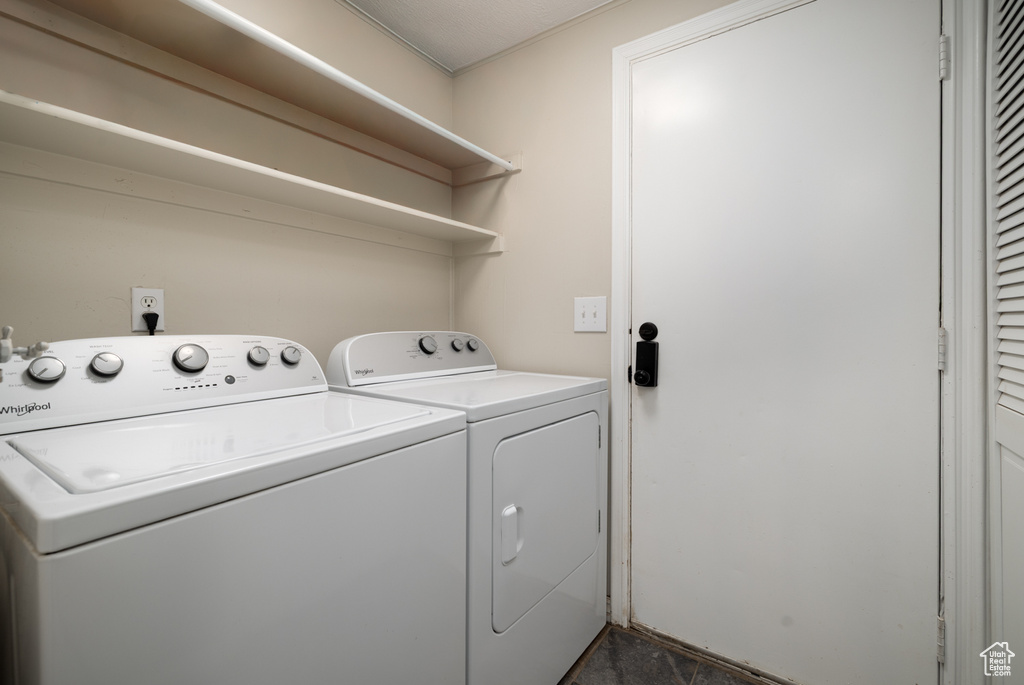 Laundry area featuring laundry area and washer and clothes dryer