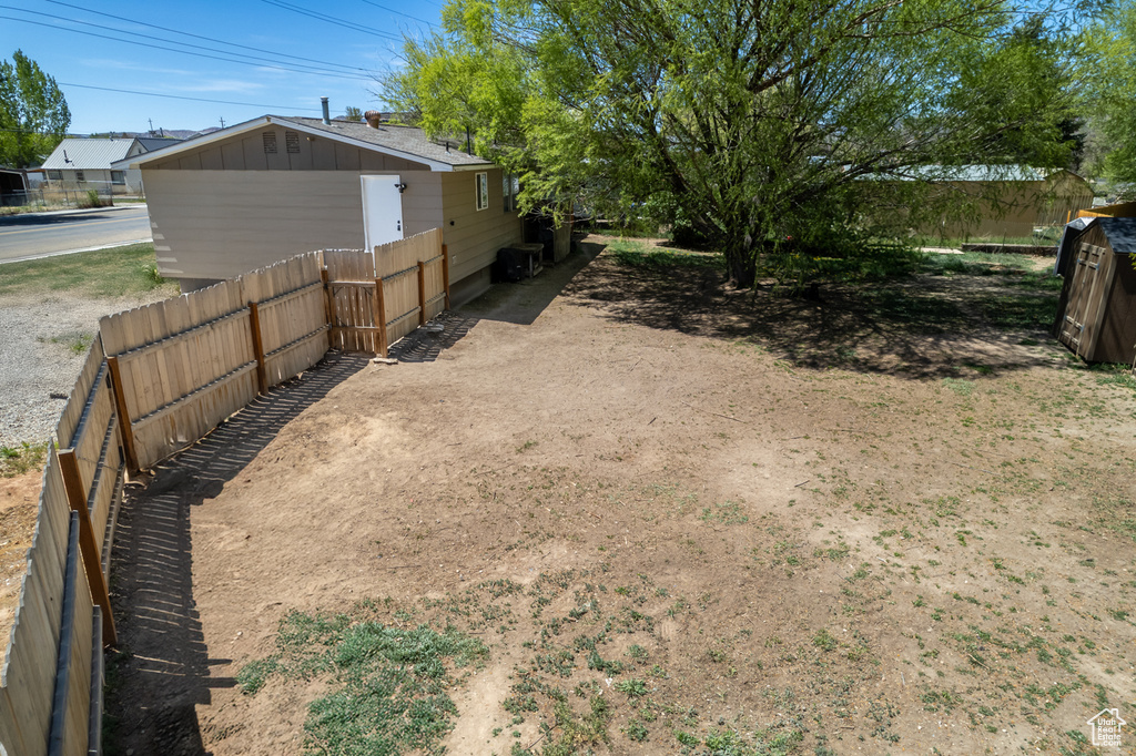 View of yard featuring fence