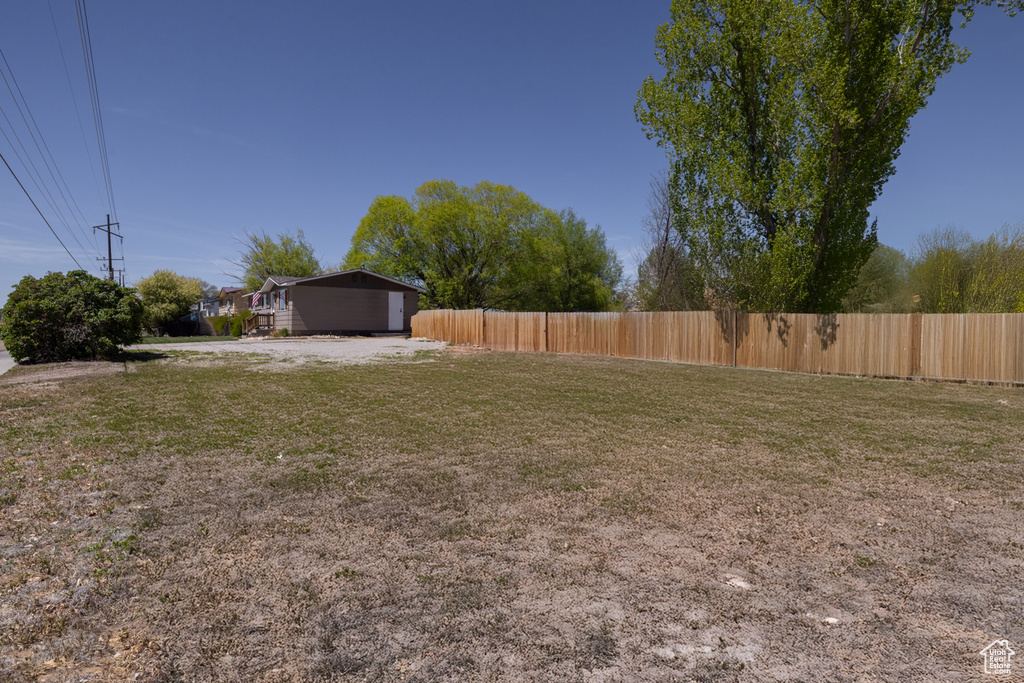 View of yard featuring fence
