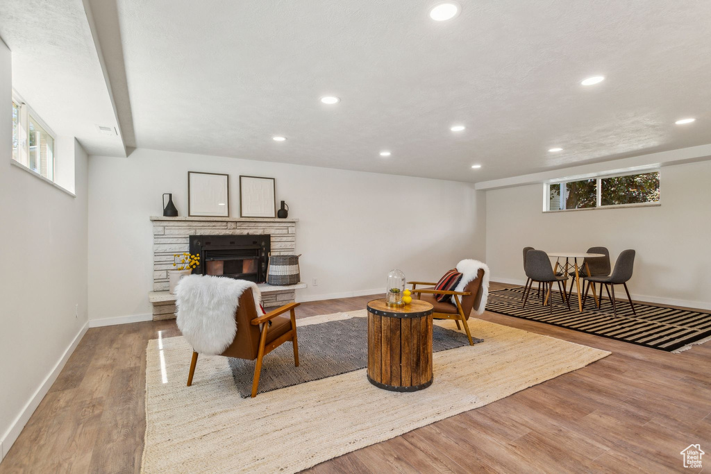 Living room featuring recessed lighting, plenty of natural light, and wood finished floors