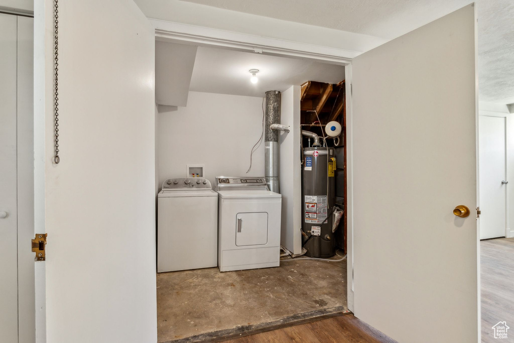 Clothes washing area with separate washer and dryer and gas water heater