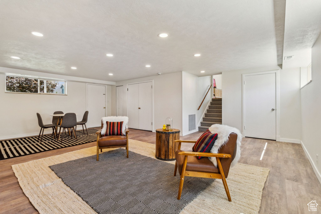 Living area featuring visible vents, recessed lighting, and light wood-style flooring