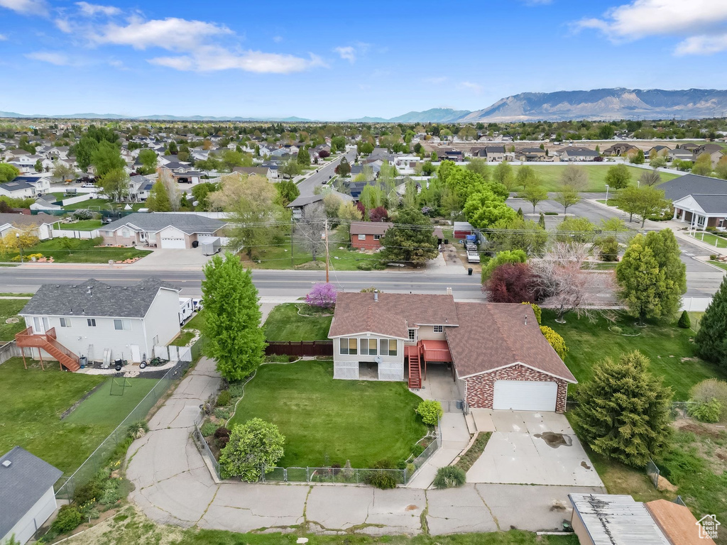 Birds eye view of property with a residential view and a mountain view