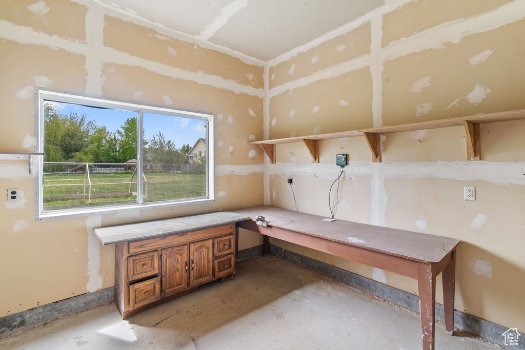 Interior space with unfinished concrete flooring