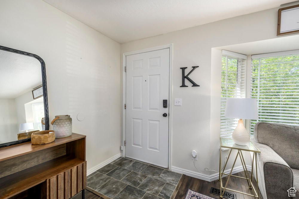 Entrance foyer featuring baseboards and visible vents