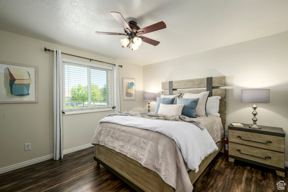 Bedroom with baseboards, a ceiling fan, and wood finished floors