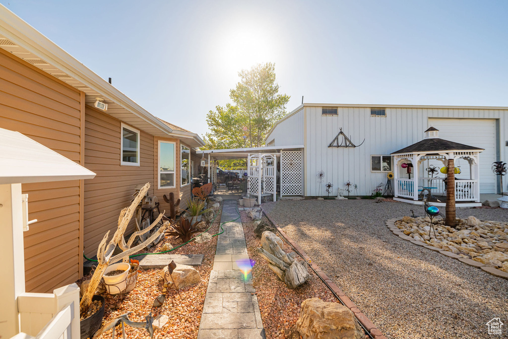 Exterior space with fence and a gazebo