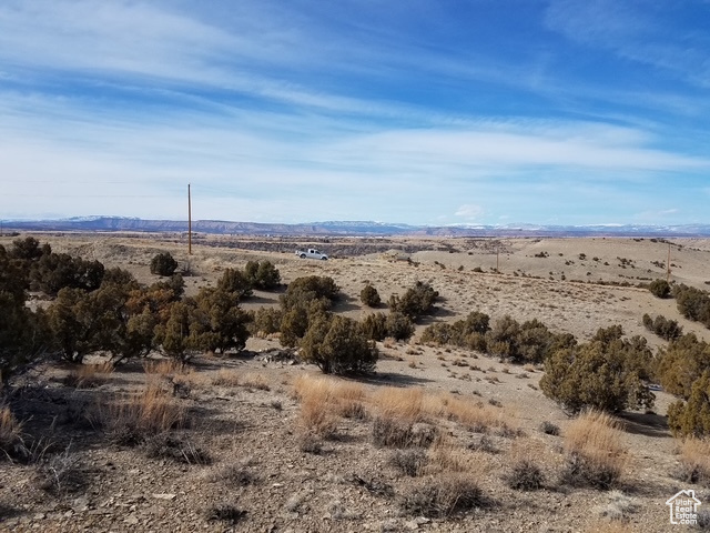 Property view of mountains featuring a rural view and view of desert