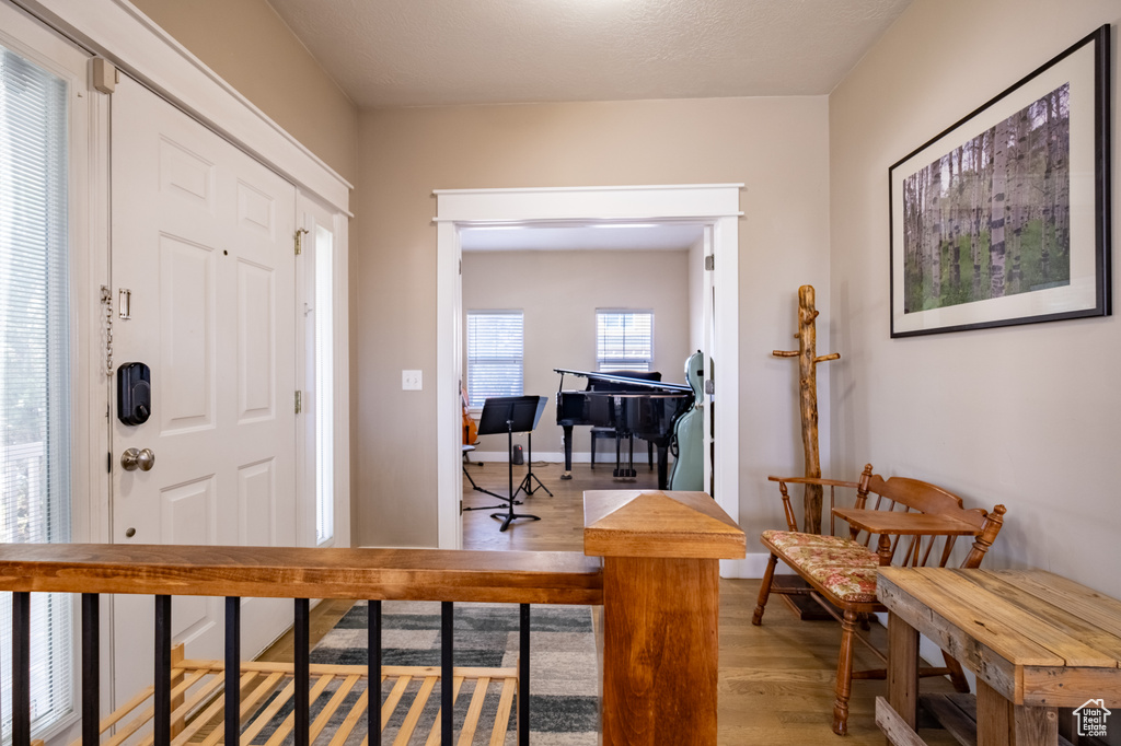 Entrance foyer featuring light wood-style flooring and baseboards
